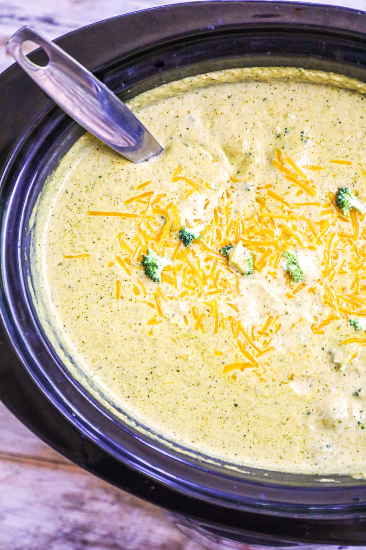 Broccoli Cheese Soup made in the crockpot topped with cheddar cheese