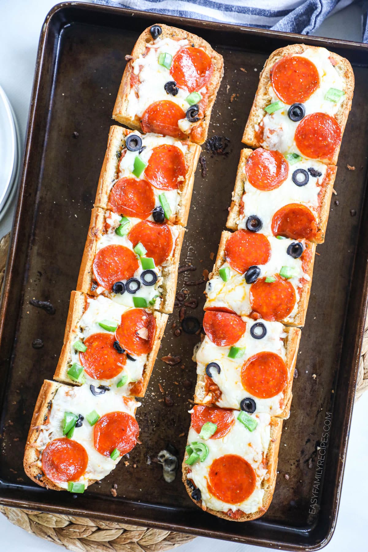 Pepperoni olive and green pepper garlic bread pizza.
