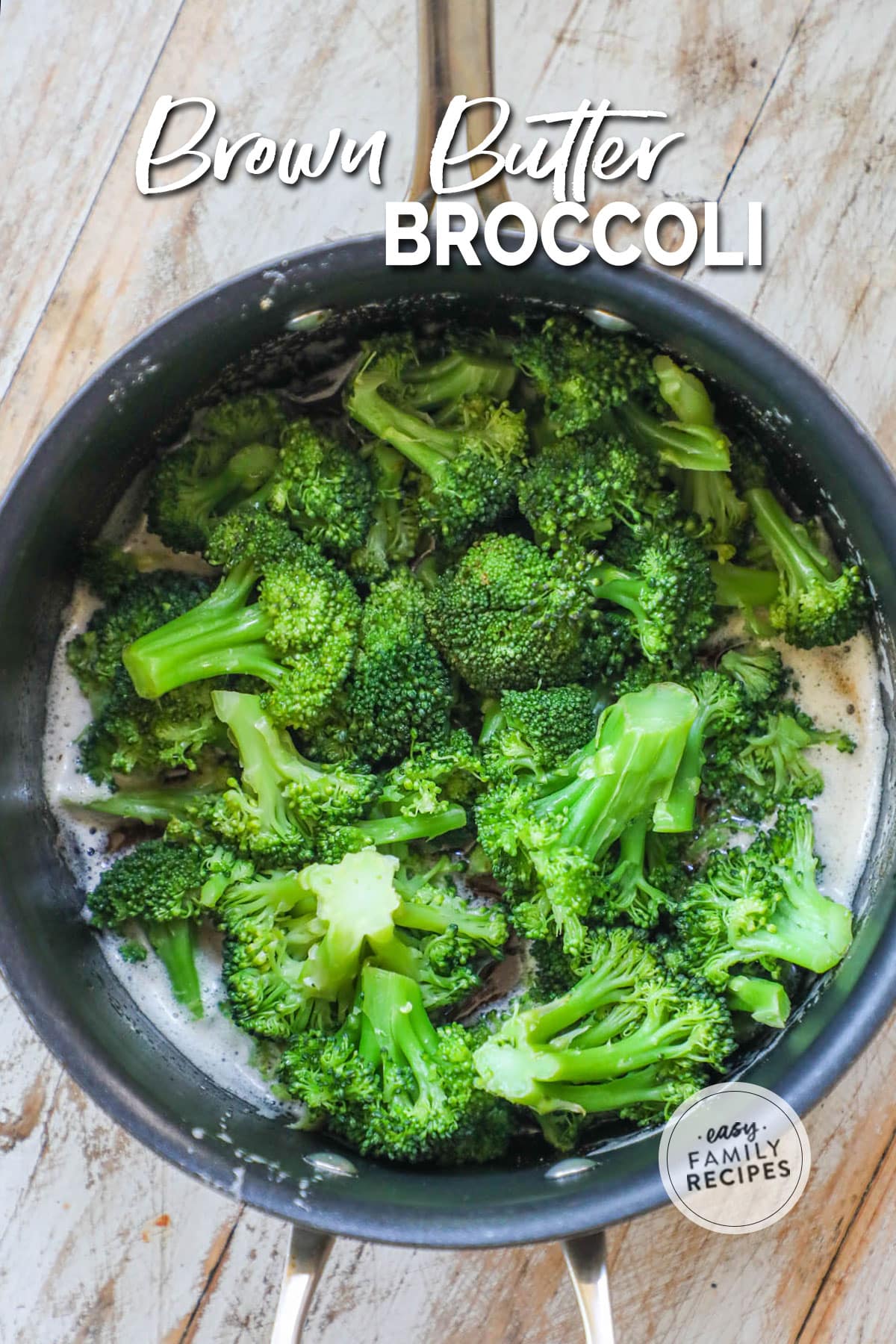 Tender crisp broccoli in a pot tossed in brown butter.