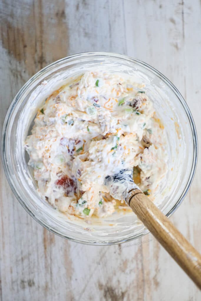 How to make Million Dollar Chicken Step 2: Mix to combine the cheese and bacon mixture.