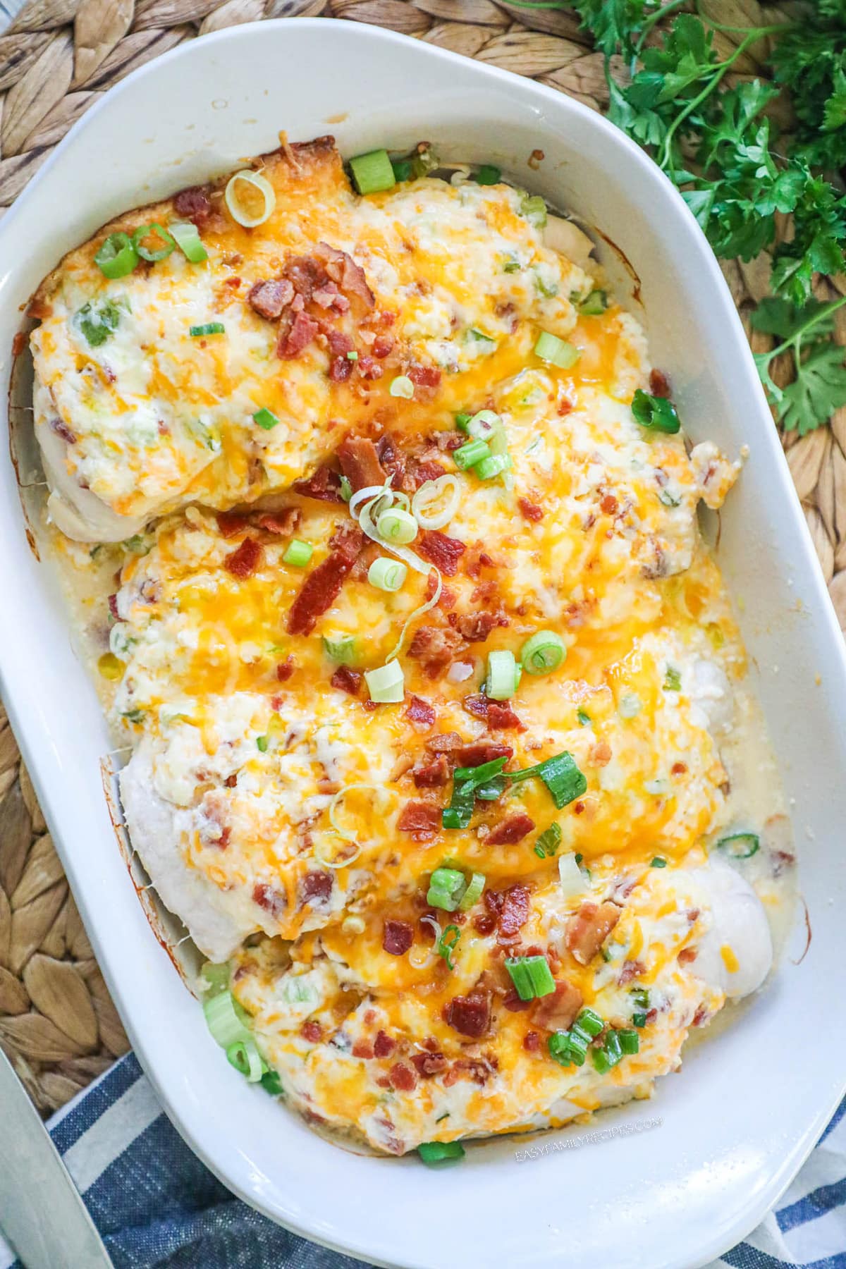 How to make Million Dollar Chicken Step 4: Bake until chicken is cooked through. Garnish with green onion and serve warm.