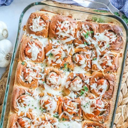 Meatball parm sliders in a tray after being baked.