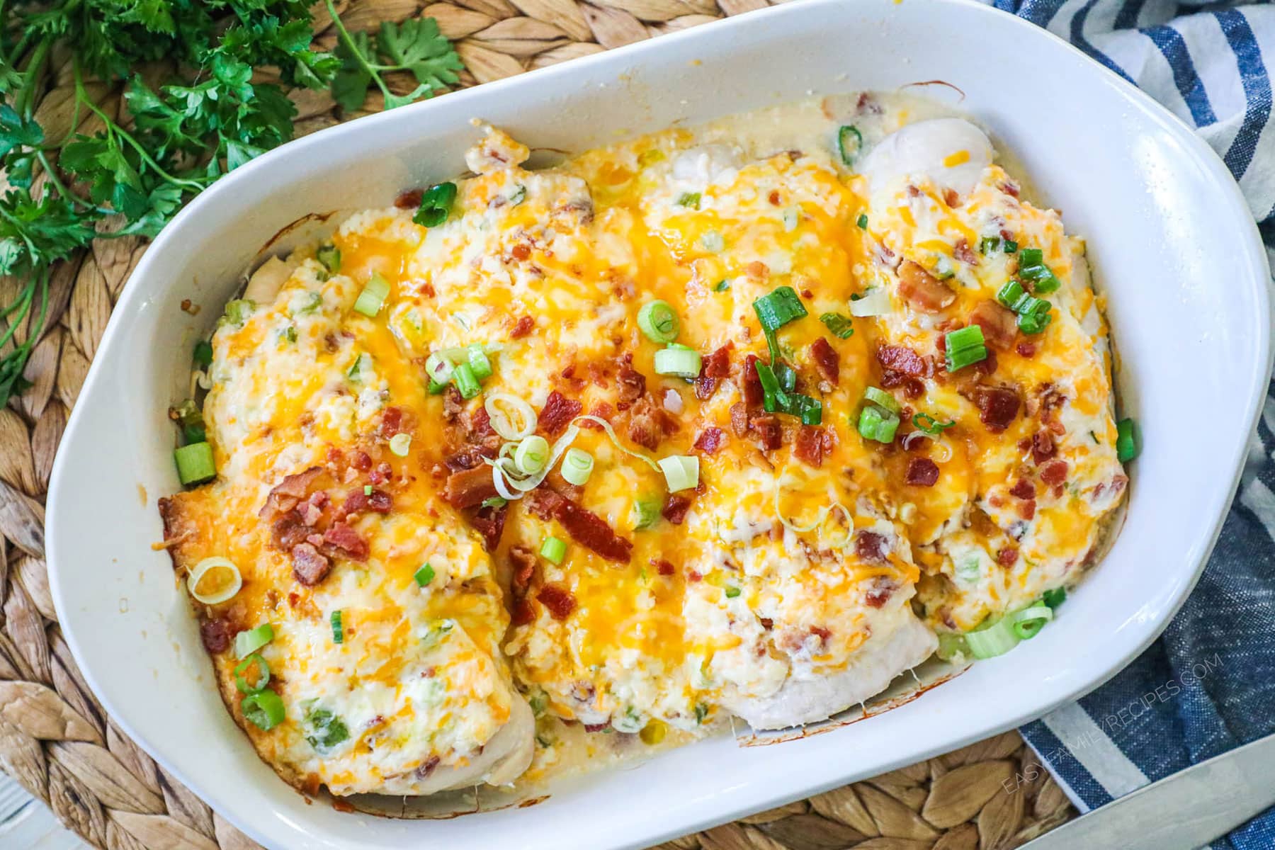 Million Dollar Chicken Recipe prepared and garnished with bacon and green onion so it is ready to serve for an easy weeknight dinner.