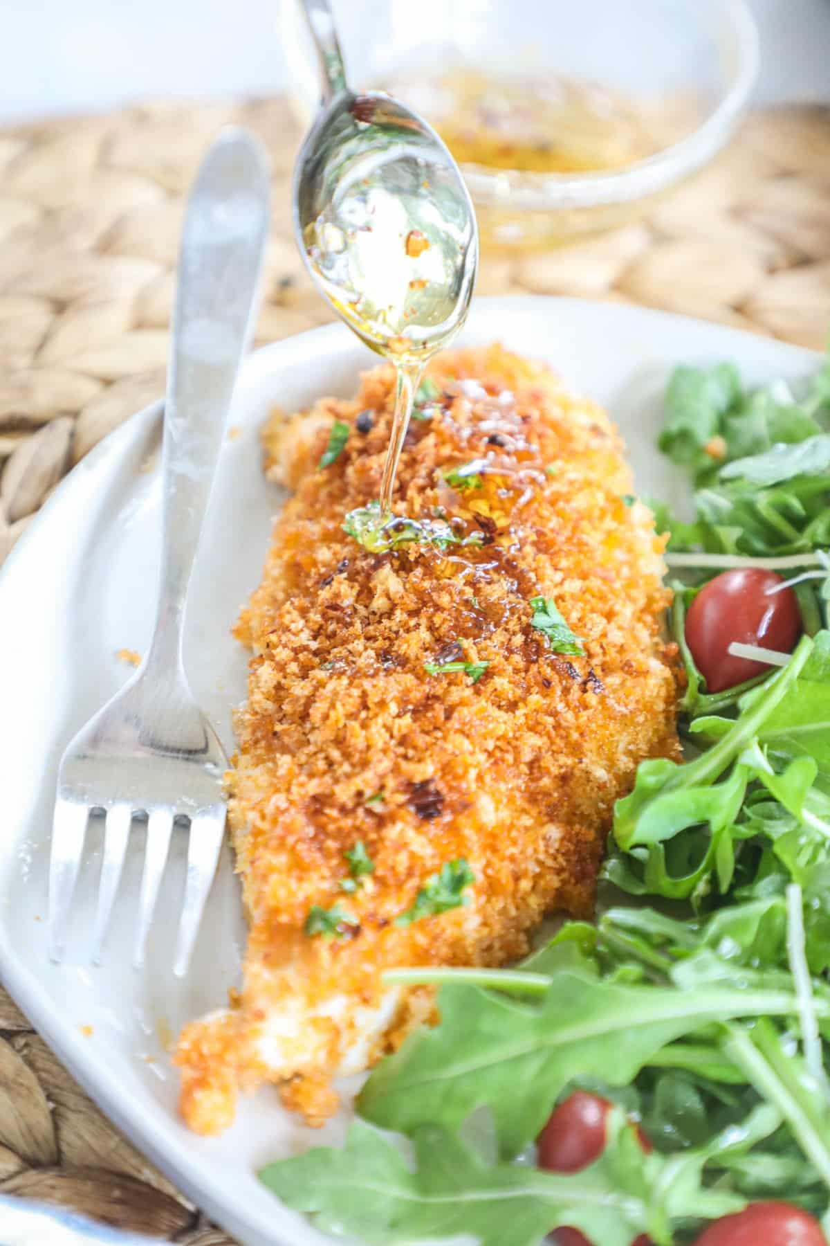 Panko Crusted Chicken served with salad on a plate.