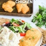 Shake and Bake Chicken breaded chicken breast on a plate served with mashed potatoes and salad
