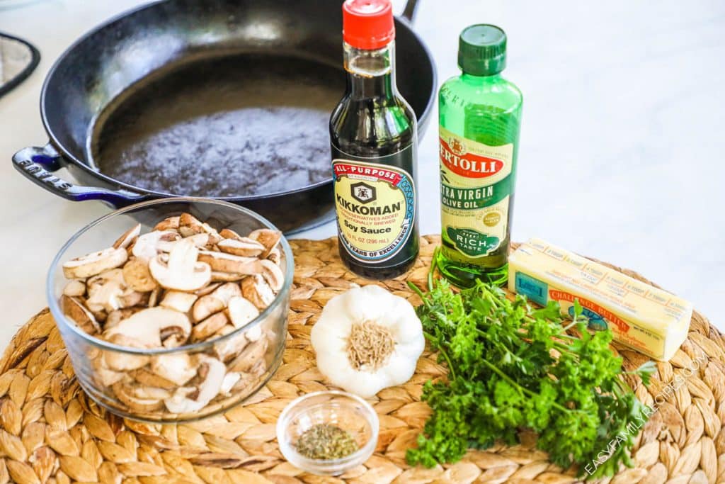 Ingredients for recipe: sliced mushrooms, soy sauce, oil, garlic, seasonings, herbs, and butter.