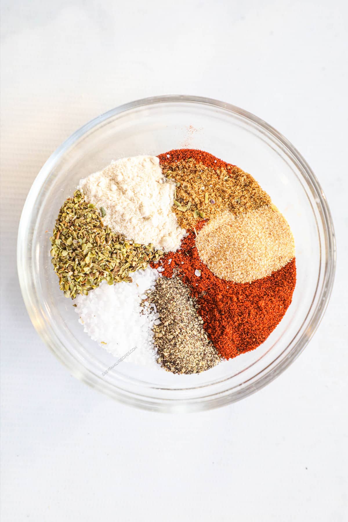 Carnitas seasoning mix in a glass bowl