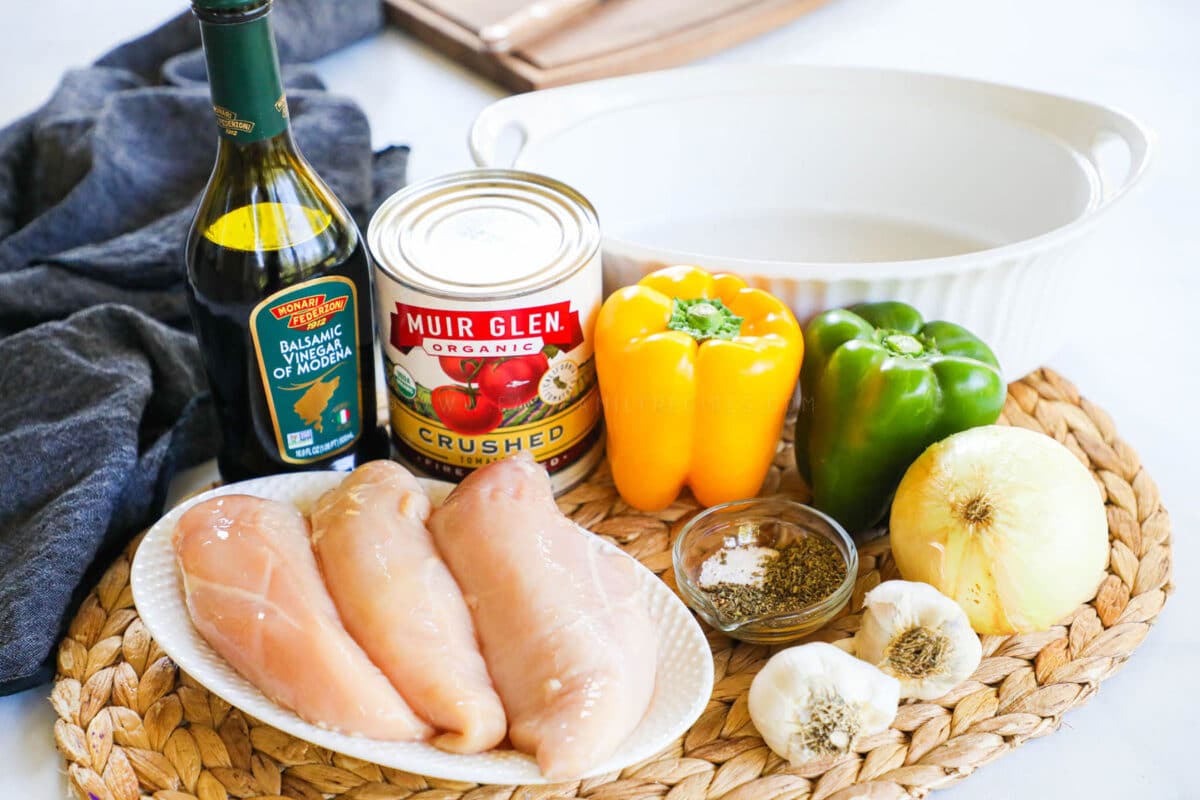 Baked Italian Chicken and Peppers Ingredients - Chicken breast, bell peppers, onions, crushed tomatoes, balsamic vinegar, Italian seasonings