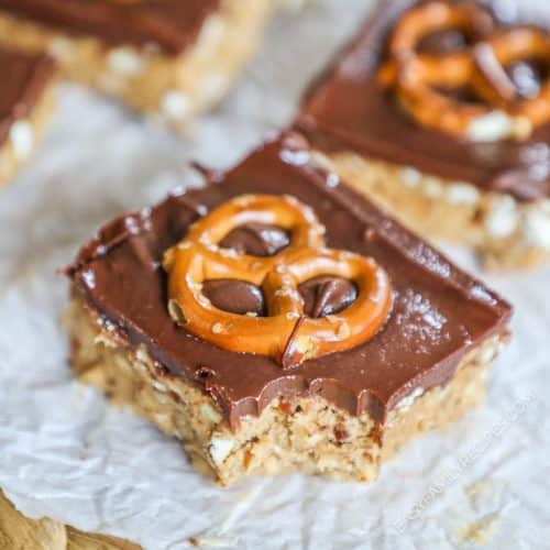 Peanut butter pretzel chocolate bars with a single pretzel twist on the top of each square.