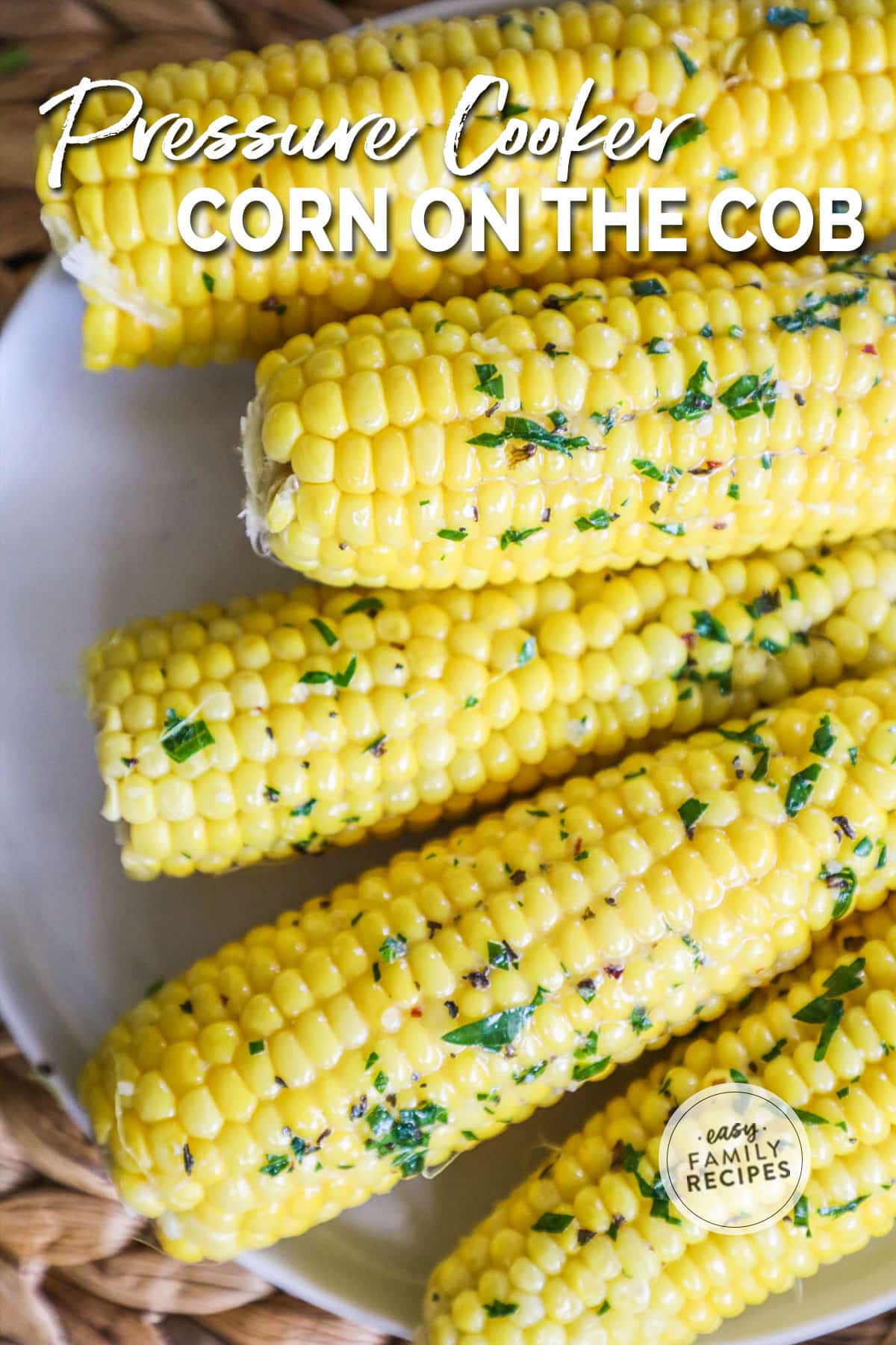 Corn on the cob with garlic butter on a plate.