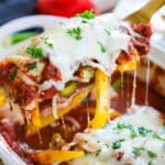 Baked Italian Chicken and Peppers being scooper out with a spoon