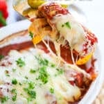 Baked Italian Chicken and Peppers being scooper out with a spoon
