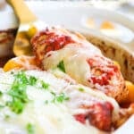 Baked Italian Chicken and Peppers being scooper out with a spoon