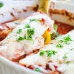 Baked Italian Chicken and Peppers being scooper out with a spoon