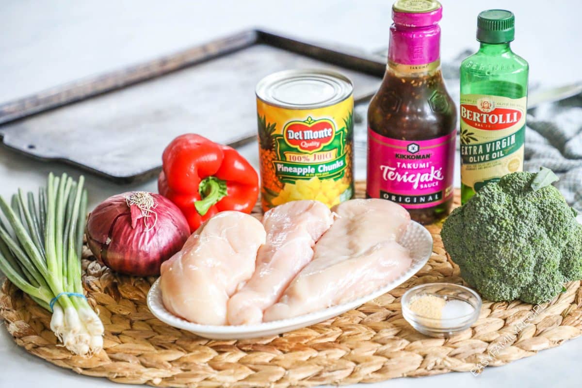 ingredients to make baked pineapple chicken including chicken breast, red pepper, canned pineapple, teriyaki sauce, and onion.