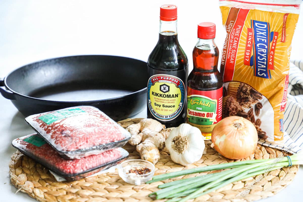 ingredients to make korean beef skillet including ground beef, soy sauce, sesame oil, ginger, garlic, onion, and brown sugar.