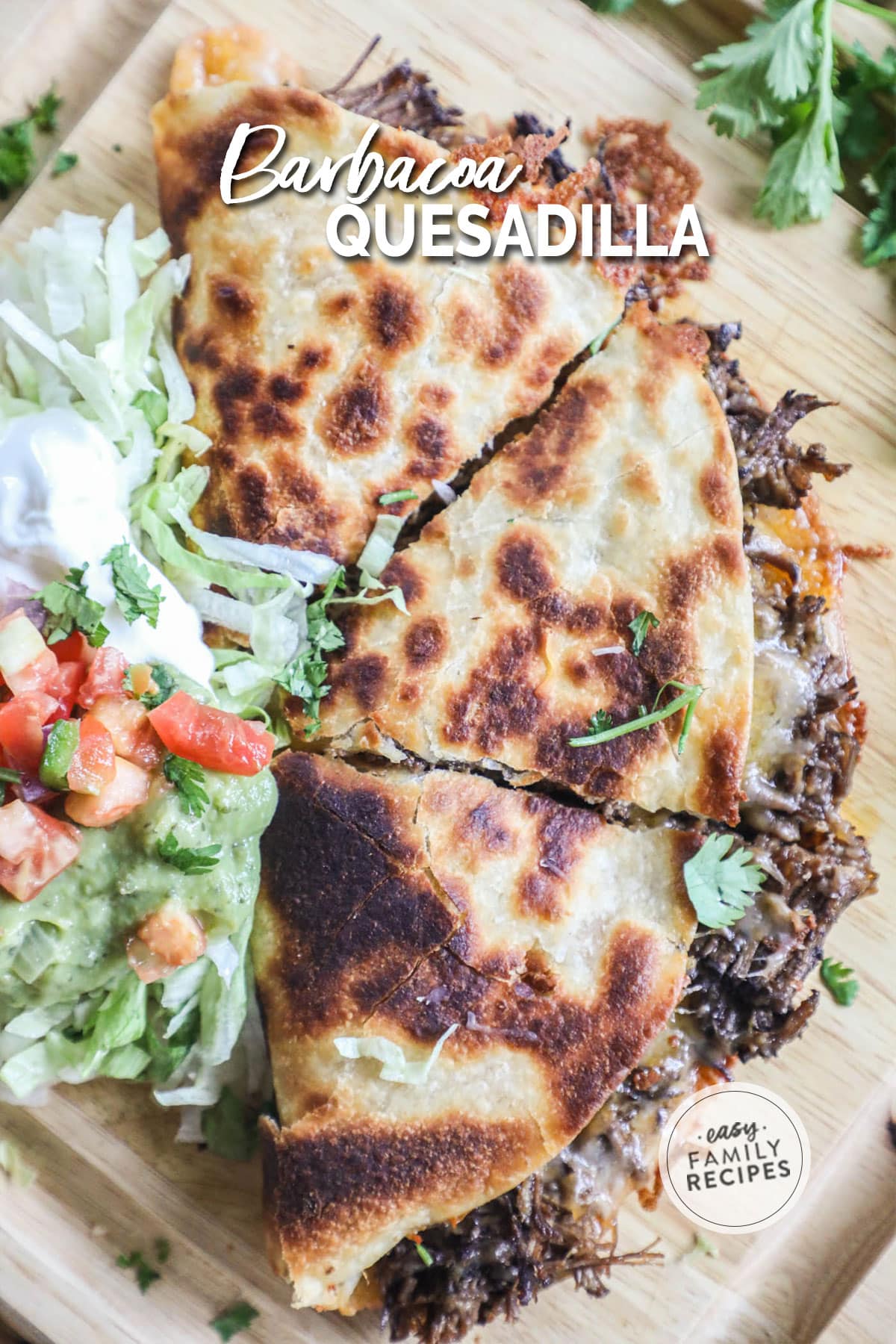 Barbacoa quesadilla that is golden brown and topped with guacamole, pico, and shredded lettuce.