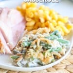 A plate of classic holiday food - macaronie and cheese, ham and green bean casserole