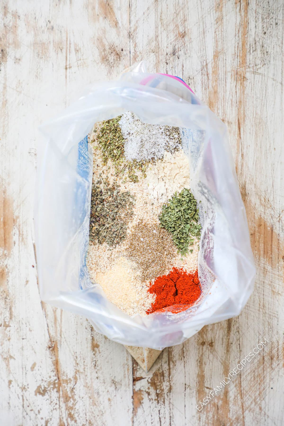 How to make Homemade Shake and Bake Pork Chops Step 1: Put bread crumbs and seasonings in a bag.