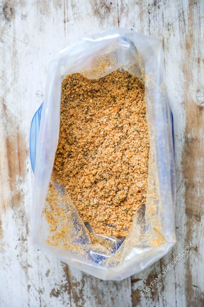 How to make Homemade Shake and Bake Pork Chops Step 2: Mix the seasonings with the breadcrumbs and oil to create the breading.