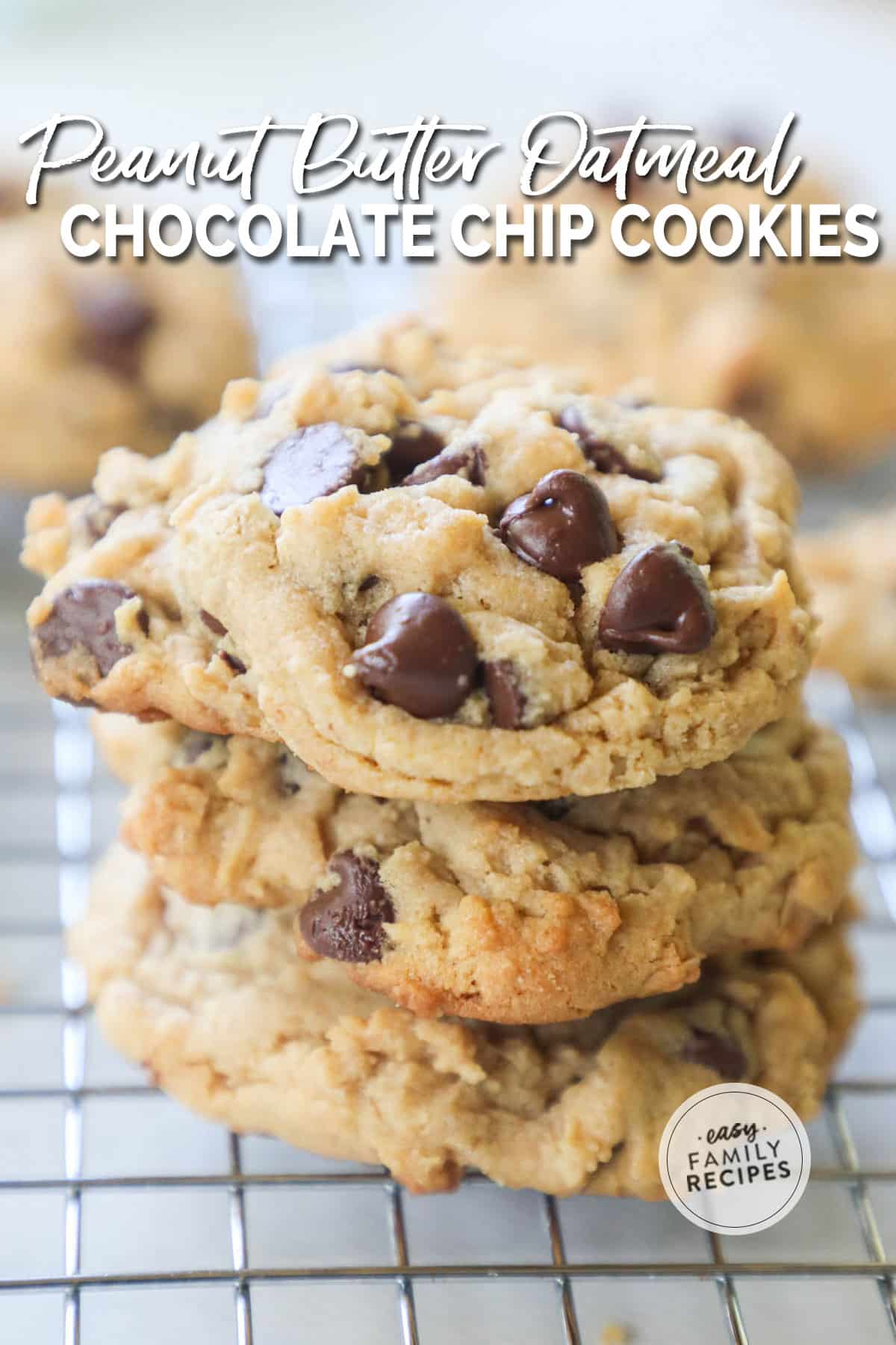 Stack of 3 peanut butter oat cookies with chocolate chips sitting on a wire rack with a few behind.