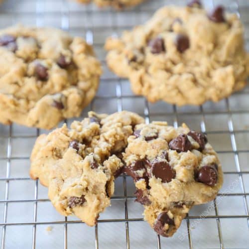 Cookies on a wire rack with one split partially in half.