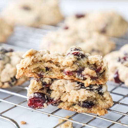 Cranberry Oatmeal Cookie broken in half to show the soft chewy center