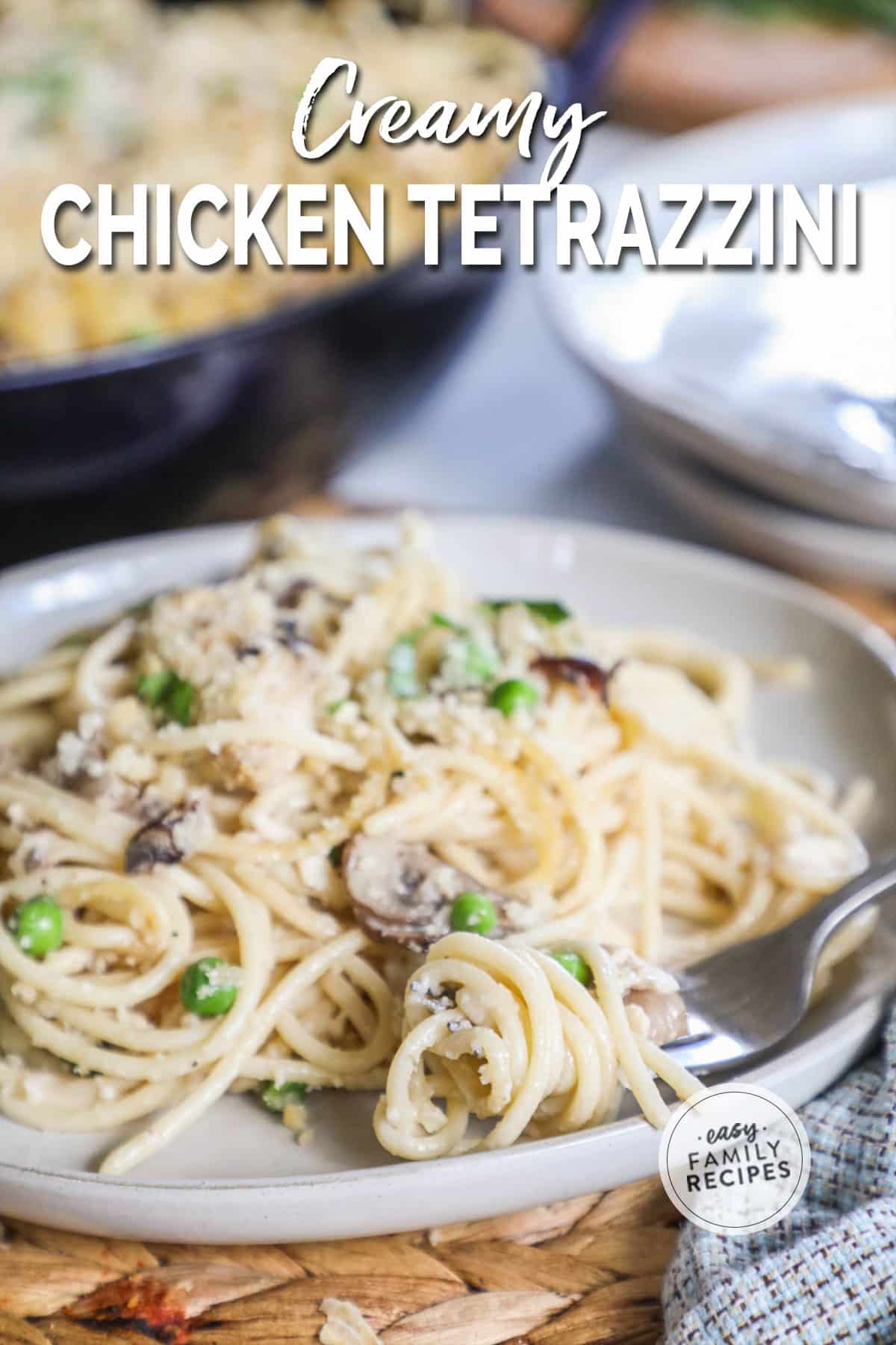 a plate of creamy chicken tetrazzini with a fork.