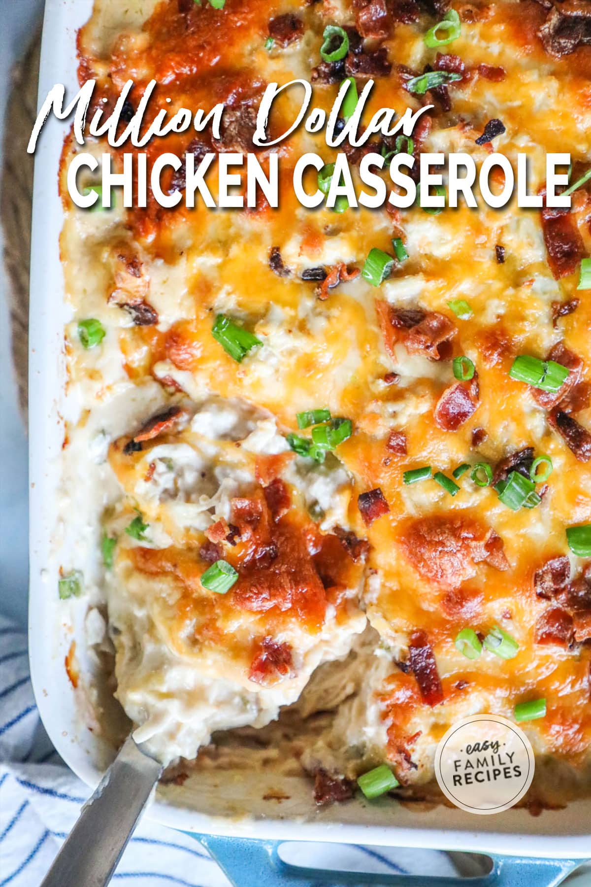 Million Dollar Chicken Casserole in baking dish with a serving spoon dipped in.