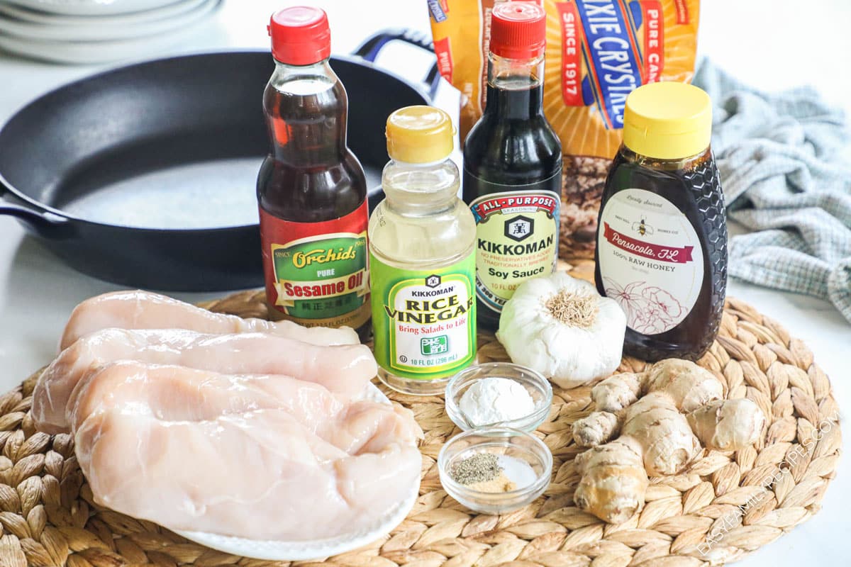 Ingredients for teriyaki chicken including chicken breast, soy sauce, ginger, garlic, salt, pepper, sesame oil, brown sugar, honey, and rice vinegar.