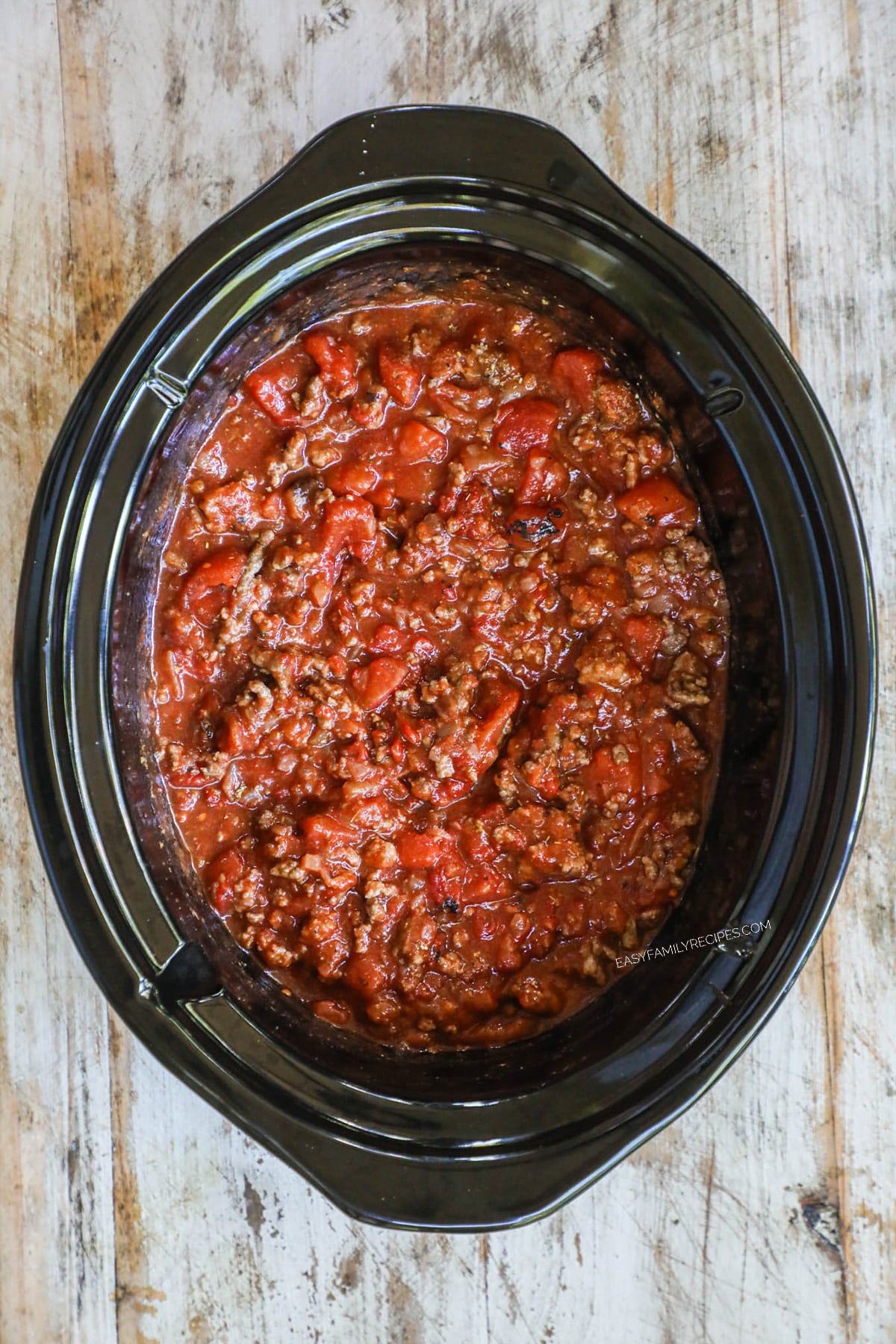 spaghetti meat sauce in a crockpot after it has been simmering for a few hours.