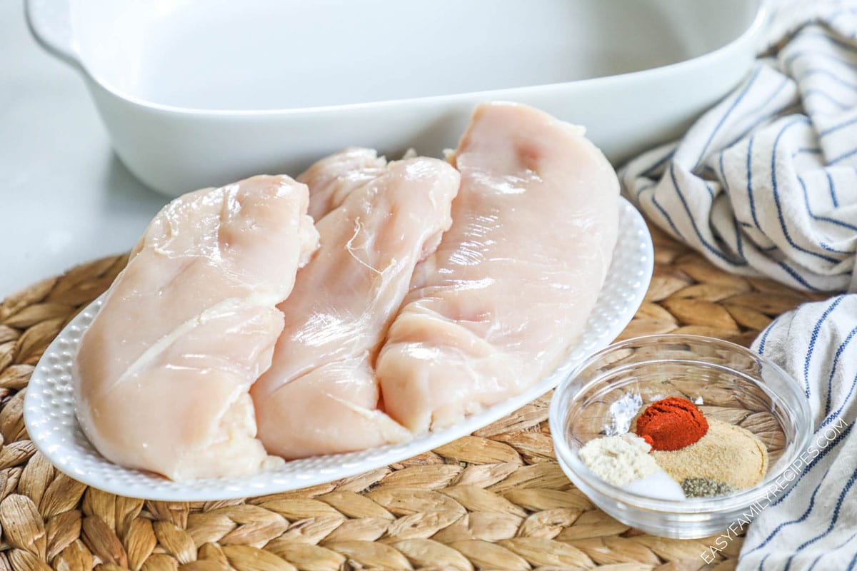 Ingredients for making the best baked chicken- Chicken breast, salt, pepper, garlic powder, casserole dish