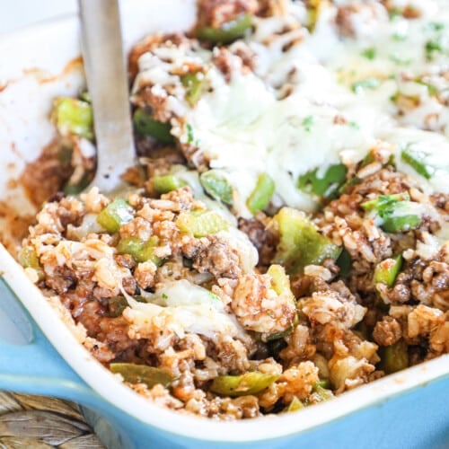 Scooping Stuffed Pepper Casserole out of serving dish.