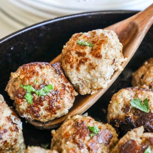 Image collage with one photo of the homestyle meatballs in a skillet on the stove. The other image is of meatballs on a platter after they have come out of the oven. The meatball is cut open to show the juicy inside.