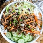 Easy Korean Ground Beef Bowl garnished with green onions and carrots.