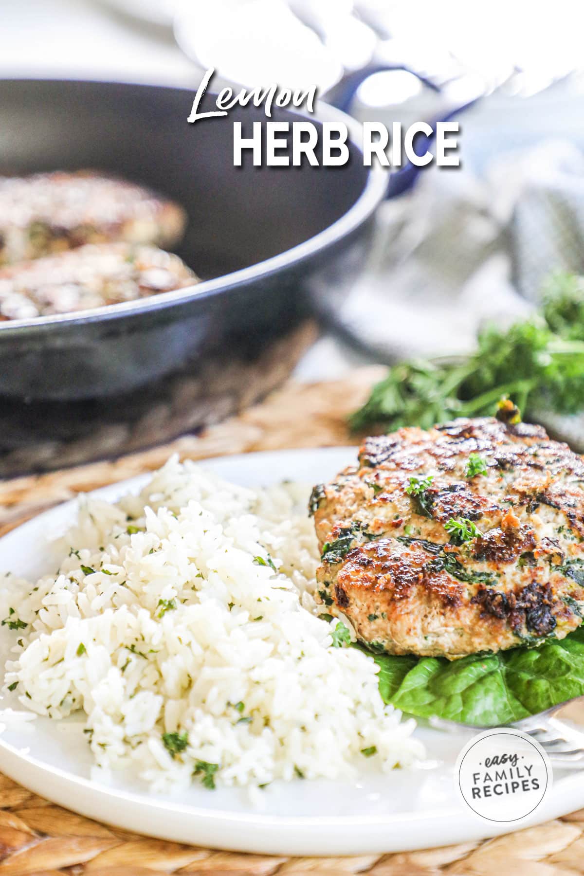a plate piled with lemon herb rice, lettuce, and grilled chicken.
