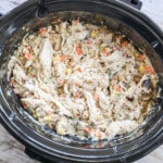 Chicken and stuffing in a slow cooker after it has cooked for 3-4 hours