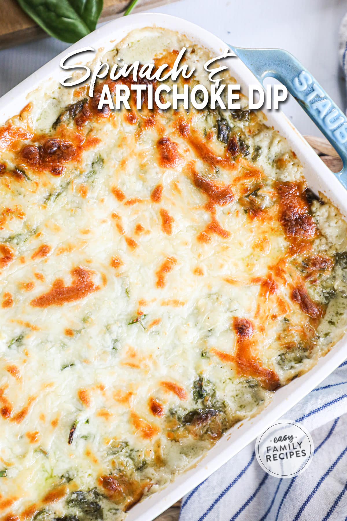 Golden brown spinach dip in a baking dish after baking