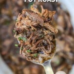 French Onion Pot Roast being lifted from crockpot.