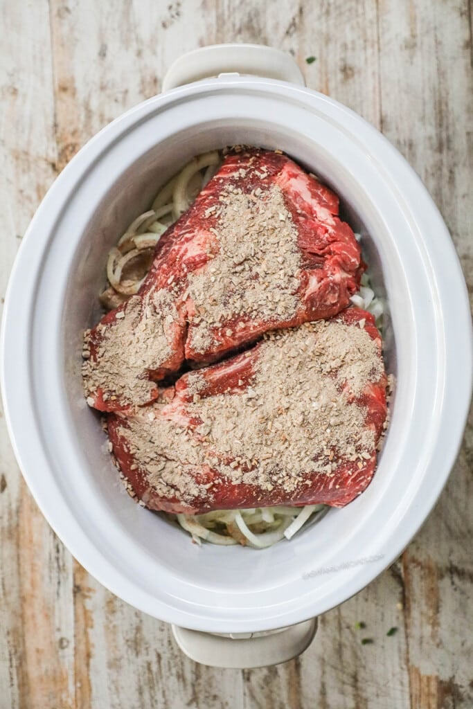 How to make French Onion Pot Roast step 3: Cover roast with french onion soup mix.