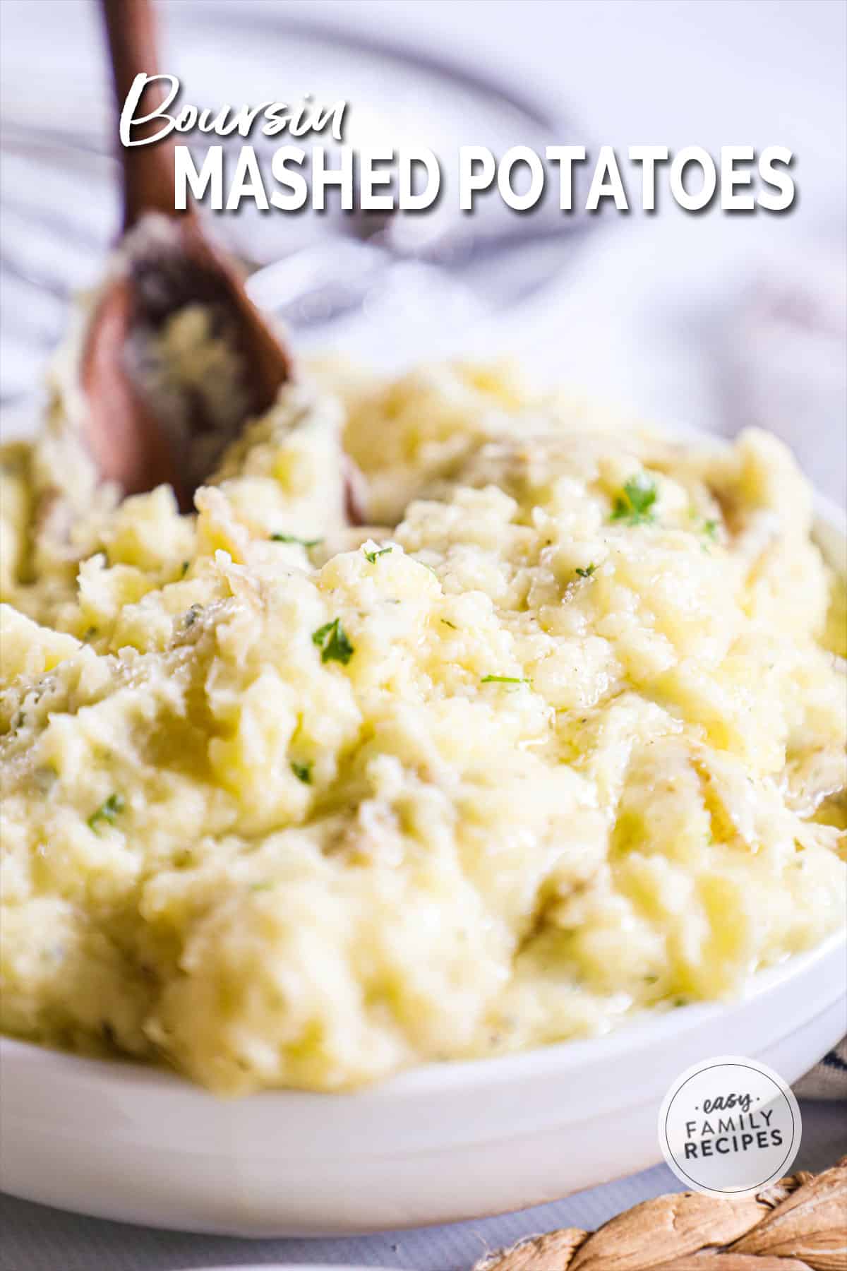 a white bowl filled with mashed potatoes.