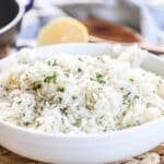 Lemon rice in a white serving bowl