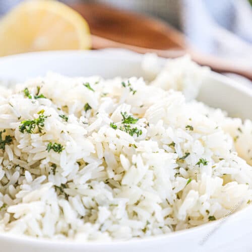Lemon rice in a white serving bowl