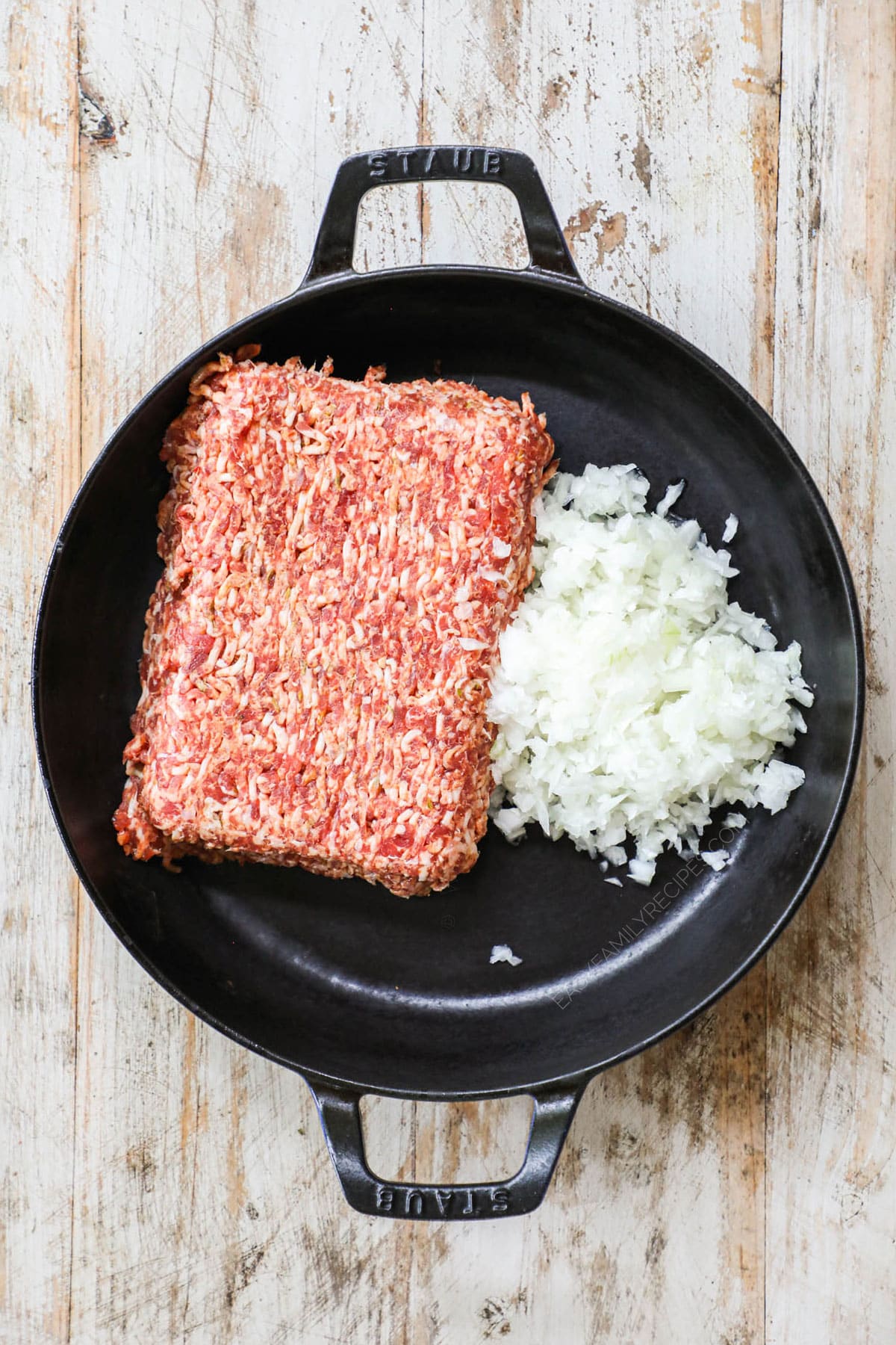 Step 1 for stuffed spinach and sausage shells - brown sausage and onion step 2 - Add cream cheese, parmesan and garlic. then add the spinach and parsley and stir to combine.