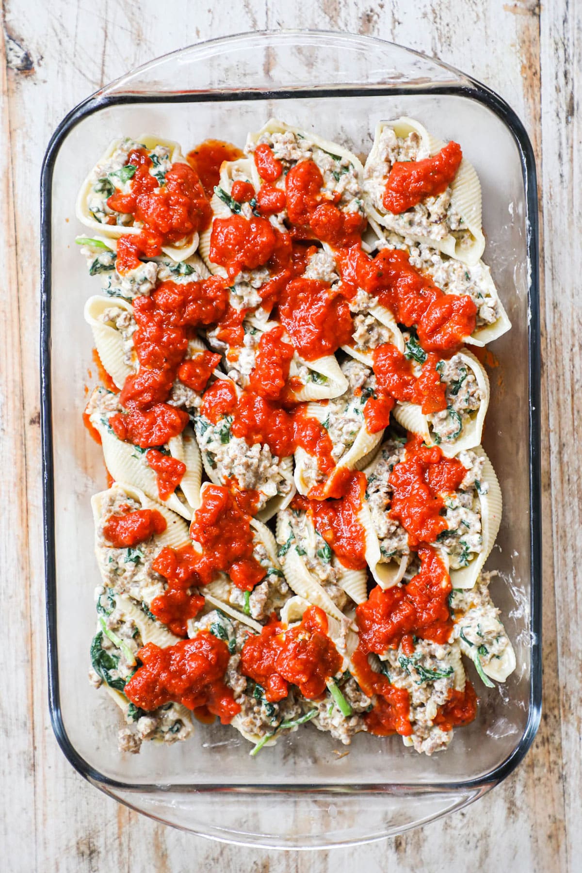 step 4 add marinara to tops of stuffed shells