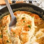 Creamy dijon chicken being lifted from the skillet.