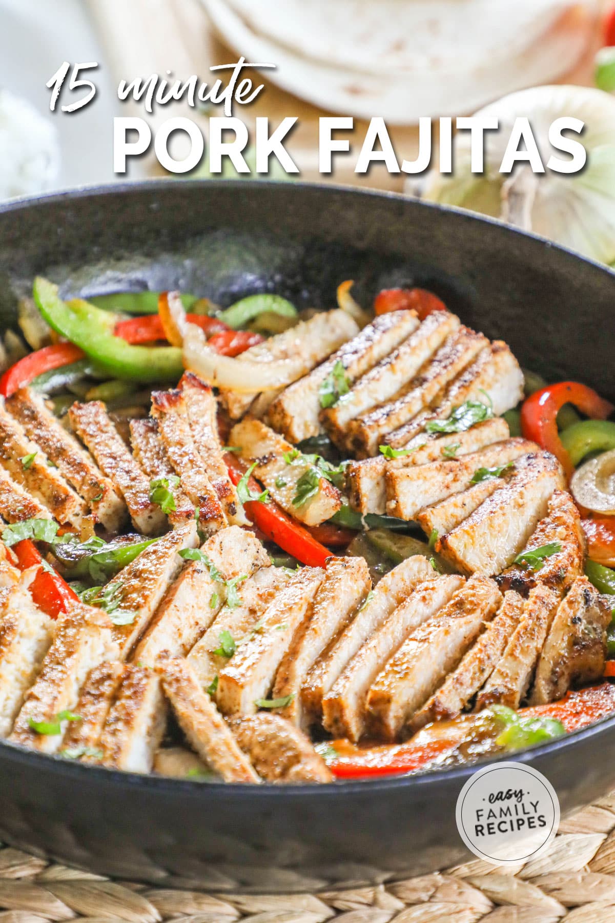 Slice pork, peppers, and onion in a skillet.