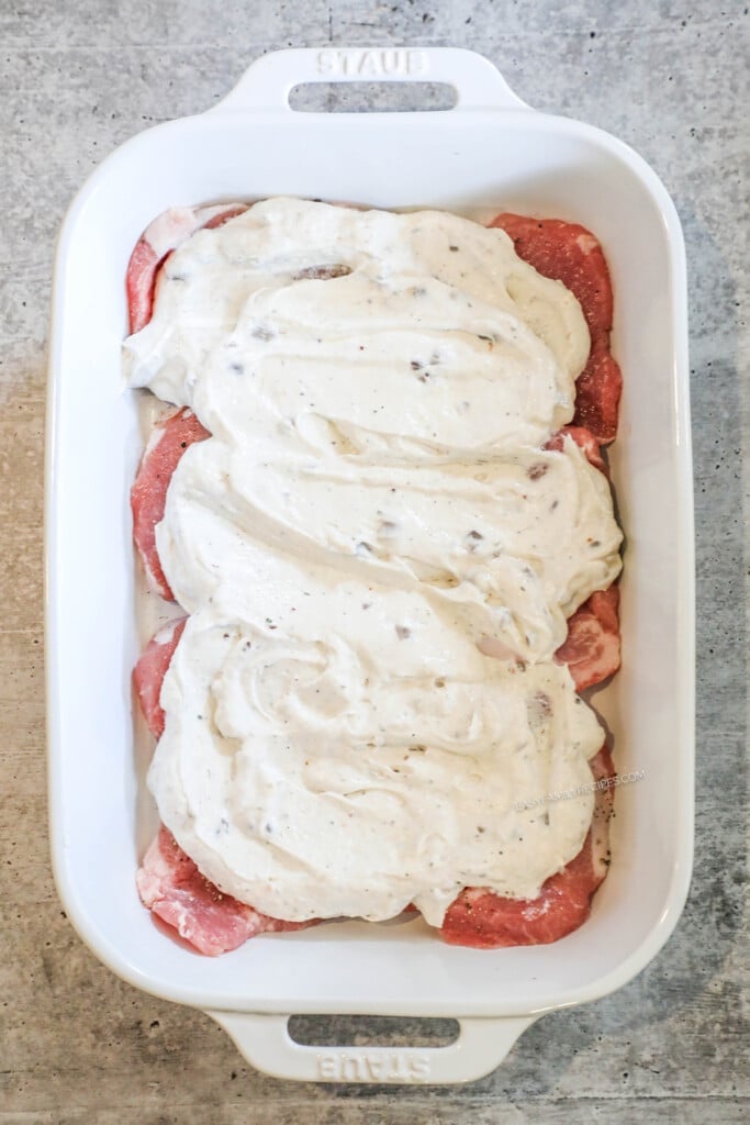 How to make cream of mushroom pork chops step 3: Spread mushroom soup mixture over pork chops.