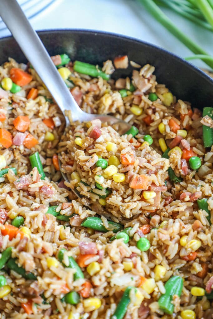 How to make easy ham fried rice step 4: garnish with green onions or yum yum sauce and then serve warm.