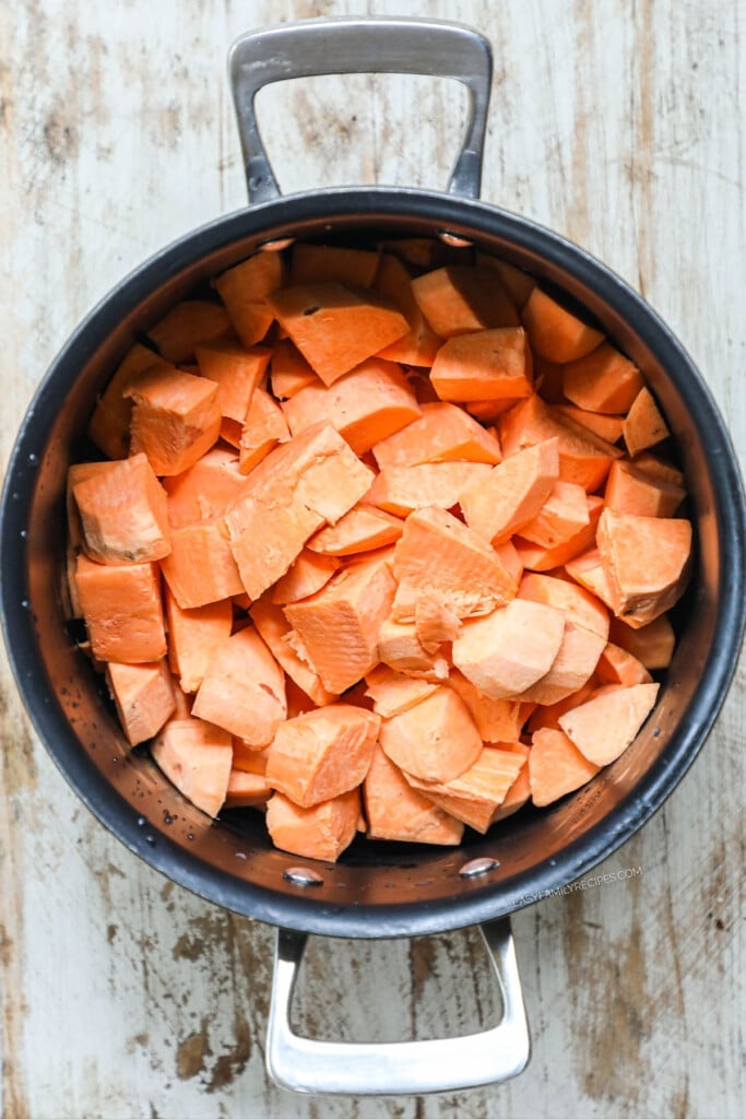 How to make savory mashed sweet potatoes step 1: Chop sweet potatoes and place them in a pot covered with water.